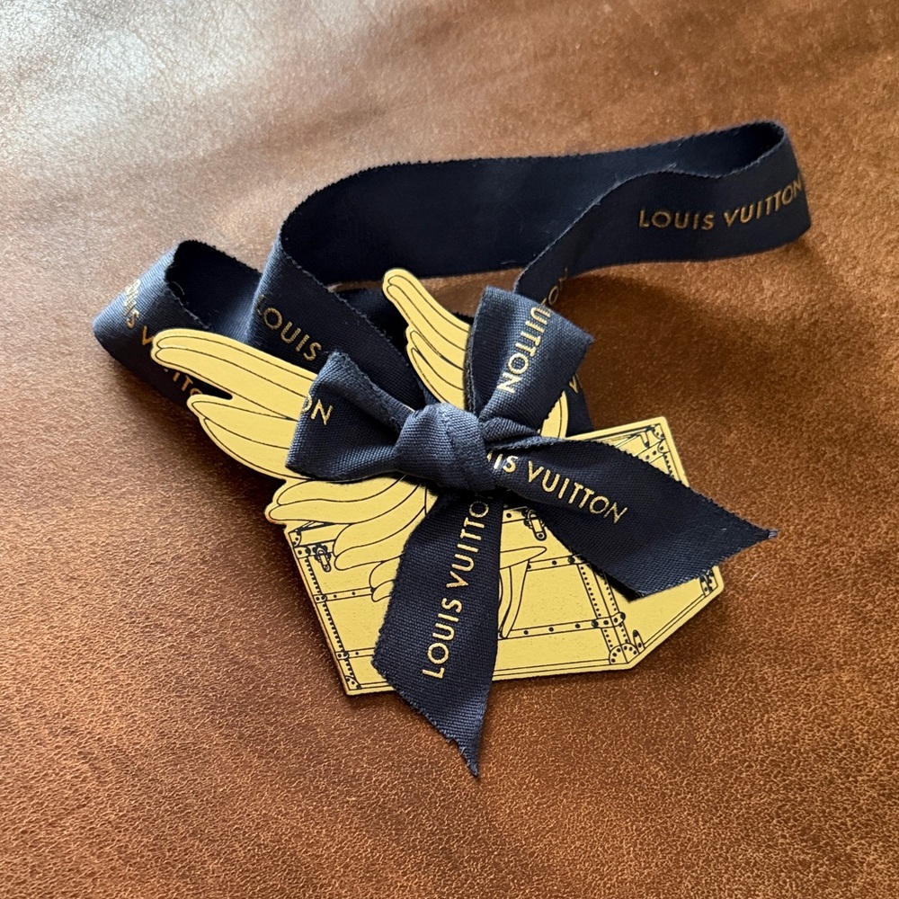 Louis Vuitton navy blue and Gold Ribbon and tag